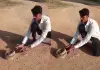 Man-lifts-deadly-snake-from-ground