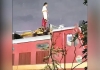 Woman-climbs-tambaram-train-engine