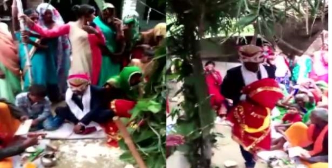 Youngman got marriage with wooden doll