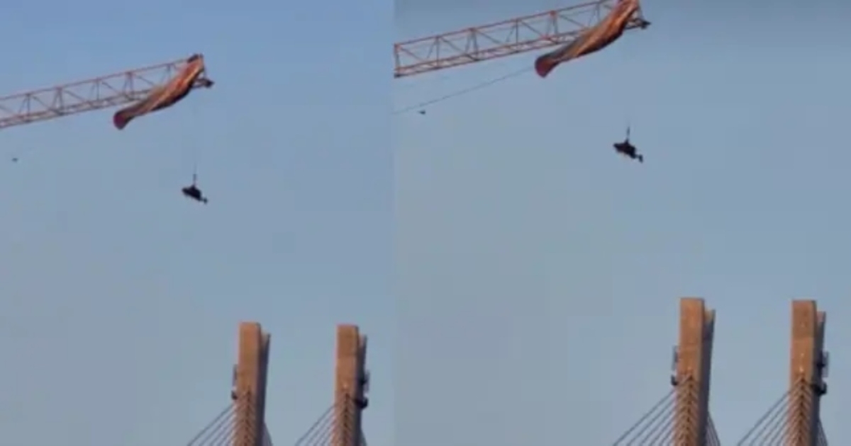 china-paragliding-man-stuck-on-tower-crane