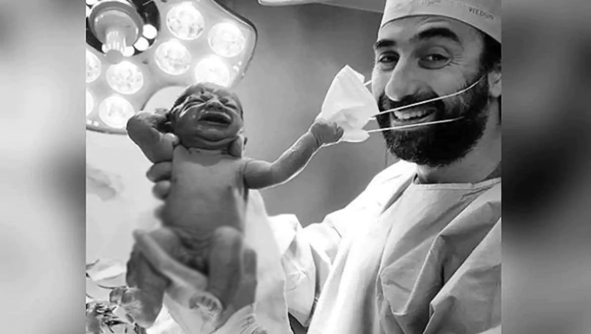 Dubai new born baby removes doctor face mask after few seconds of born
