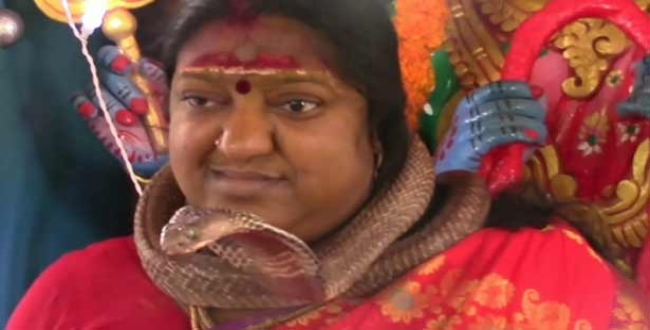 girl-priest-arrest-for-using-snake-in-temple