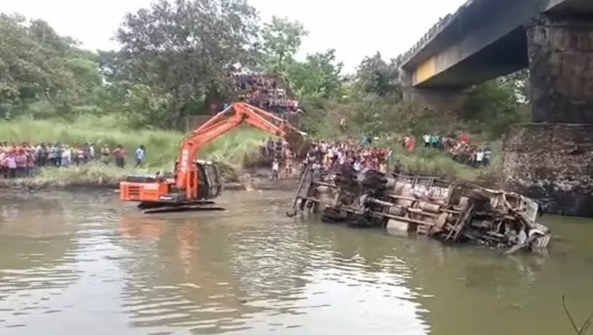 Four people were killed when a lorry plunged into a river and exploded