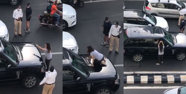angry-wife-fight-with-husband-in-mid-road-video-goes-vi