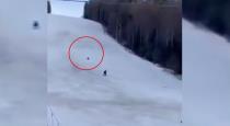 Bear chase skier man viral video