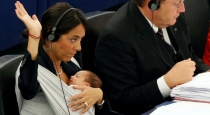 in-itay-parliment-a-woman-mp-breastfeed-her-son-for-the