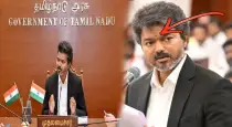 Cm-vijay-black-coat-suit-secret