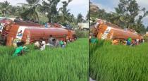 Lorry fell down on land and people takes cooking oil from the lorry