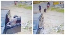 Car-owner-chases-thieves-recovers-purse-viral-cctv