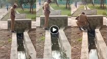 a Police Officer Helps Dog to Came out Form Sewage 