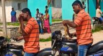karnataka-man-bite-snake-video-goes-viral