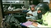govt-servent-wearing-helmet-while-working-in-office