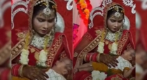 bride-holds-crying-baby-at-indian-wedding-viral-video