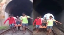 40 years old man take drinks in high space of railway track 