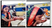 Woman-drinks-water-in-unique-way-at-railway-station