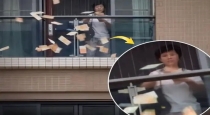 China-woman-throws-money-from-balcony-guangdong