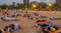 Mumbai-heatwave-power-cuts-versova-beach-sleep