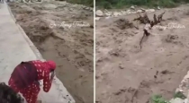 nepal-flood-woman-prays-to-raging-river