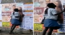 a man Kiss Sardar Movie Heroine Poster at Sivakasi while he Drunks 
